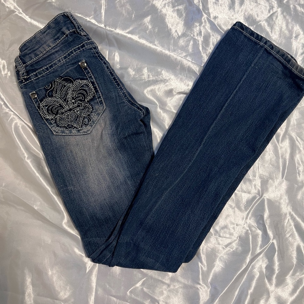 skinny bootcut low rise jeans with cool buttons, stitching and embroidery!